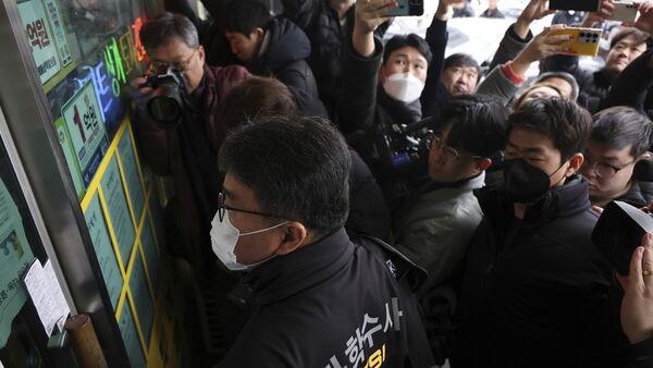 South Korea police raid home of suspect who stabbed opposition leader in neck