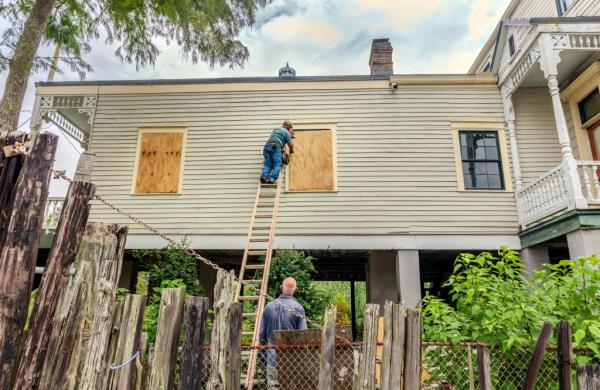 The windows of a raised historic house are boarded up as residents prepare for the arrival of Hurricane Francine along the Louisiana coast on Monday, Sept. 9, 2024, in Lafitte, La.