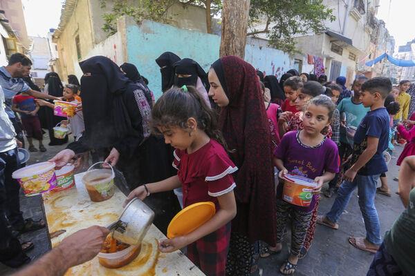 Palestinians receive food in Rafah, southern Gaza Strip, Wednesday, Nov. 8, 2023. Picture: AP Photo/Hatem Ali Palestinians receive food in Rafah, southern Gaza Strip, Wednesday, Nov. 8, 2023. Picture: AP Photo/Hatem Ali
